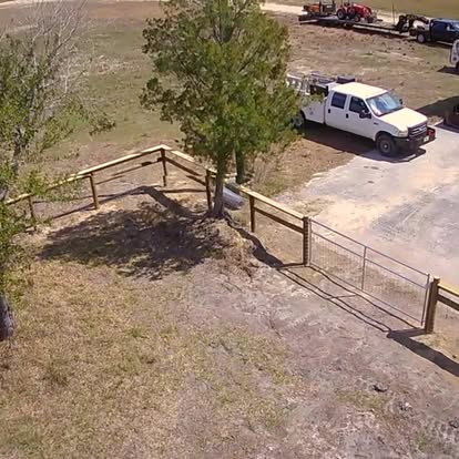 Completed fence with drive gate and D2 work truck